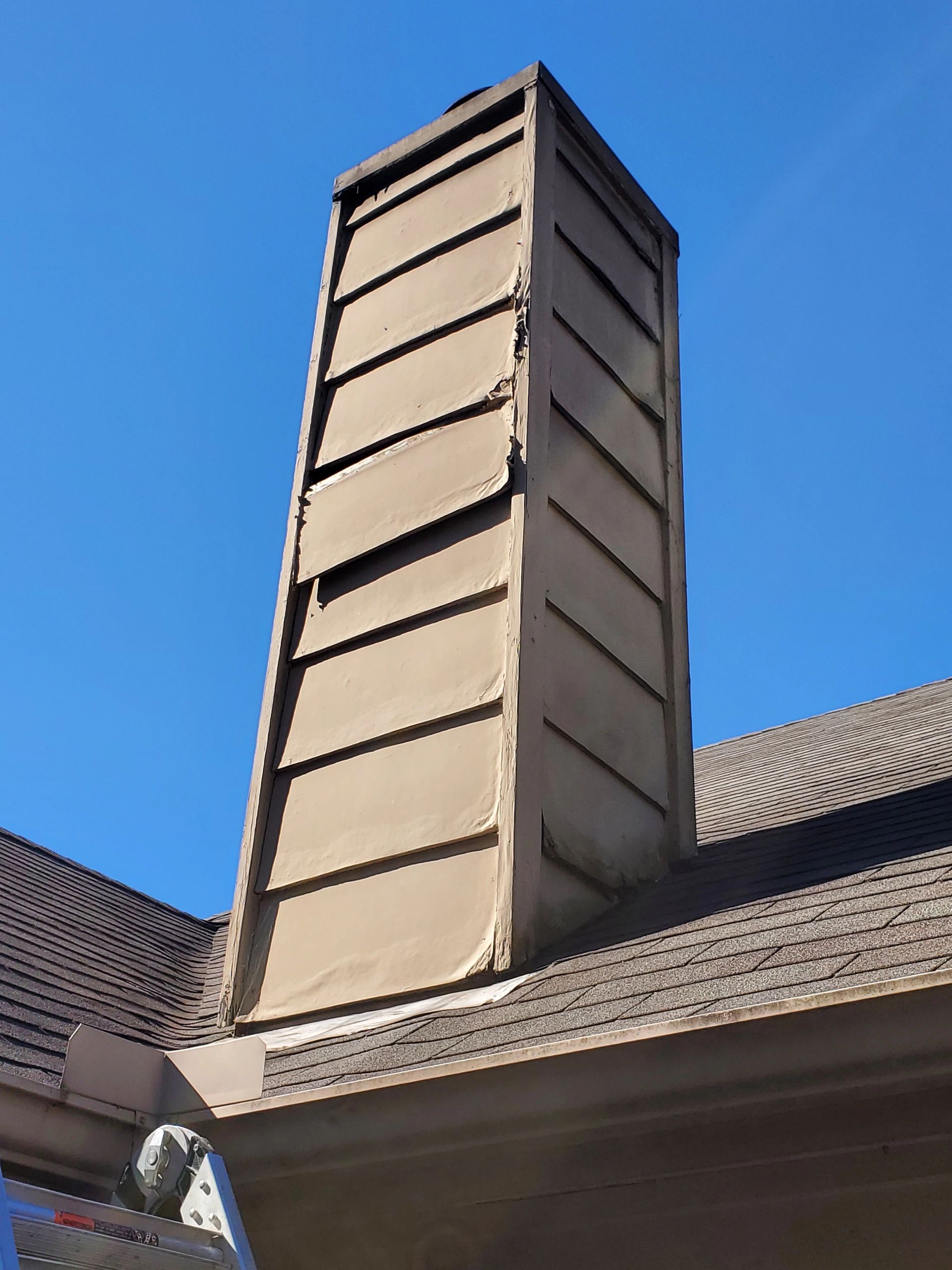 Rotten wood and siding requiring Chimney Repair